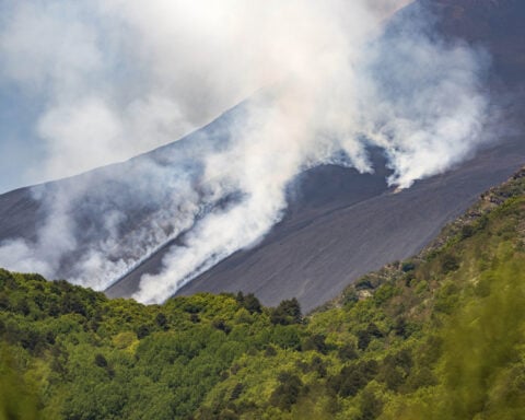 Sicily's Mount Etna erupts with columns of smoke and ash
