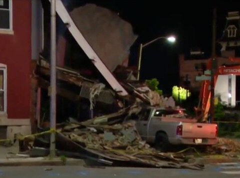 Driver taken to hospital after truck crashes into building in Baltimore, official says