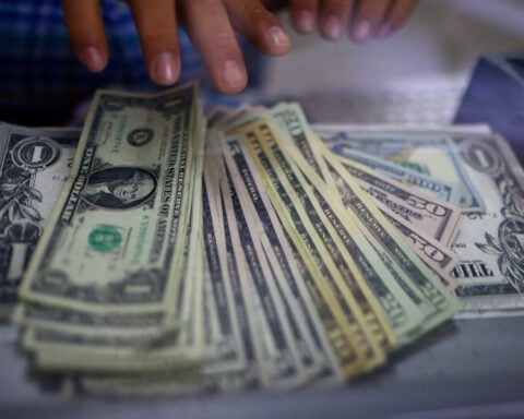 Dollar pulls back from six-week low but tariff tensions persist