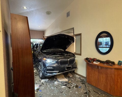 One injured after car crashes into eyecare center