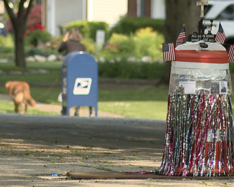 Residents turn sinkhole into community decoration project while waiting for repairs