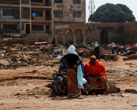 Nearly 100 missing a week after floods tore through Nigerian town