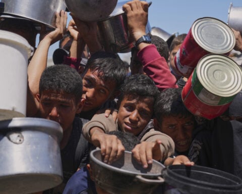 US- and Israeli-backed group pauses food delivery in Gaza after deadly shootings