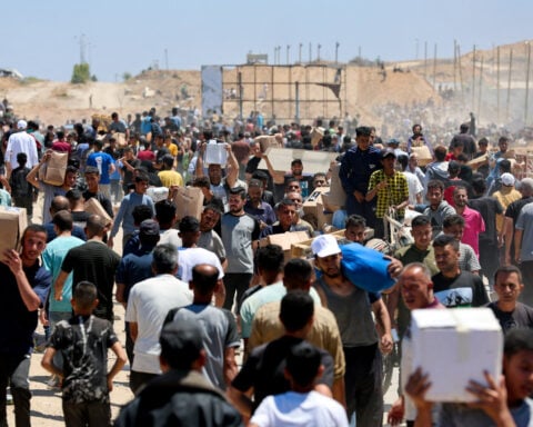 US group distributing aid in Gaza reopens sites after deadly shootings