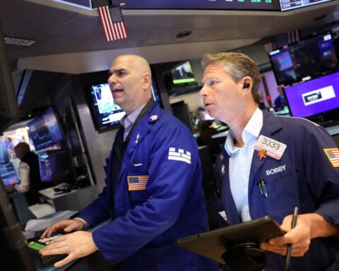 Wall Street stocks end down as Tesla slumps 14% on Trump-Musk feud