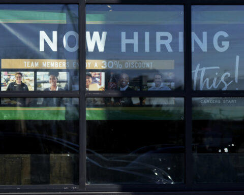 The number of Americans filing for jobless benefits last week rises to highest level in eight months