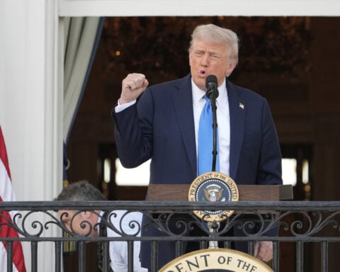 The Latest: Tesla shares fall after Trump lashes out at Musk
