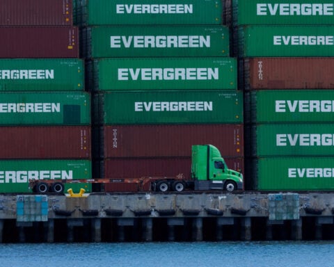 Tariff-fueled surge in container shipping rates shows signs of peaking