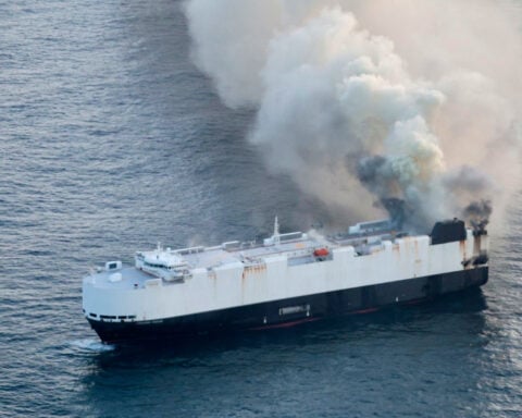 Salvage crew bound for the site of a cargo ship fire off the coast of Alaska