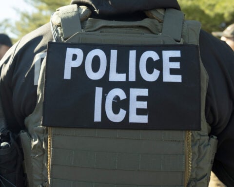 Migrants and ICE officers contend with heat, smog and illness after detoured South Sudan flight