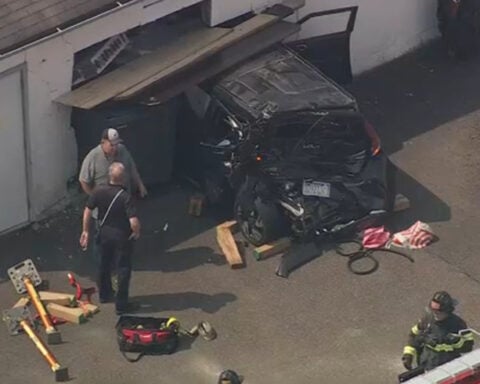 Car crashes through garage wall; multiple injuries reported