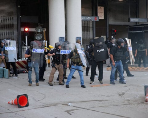 Riot police, anti-ICE protesters square off in Los Angeles after raids