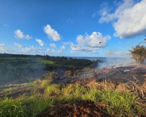 Firefighters battle a brushfire on East Kauai