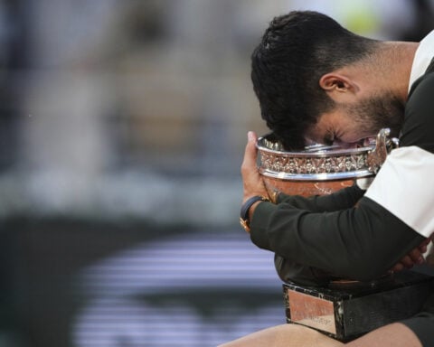 Alcaraz produces another major comeback to win French Open final in five-set thriller against Sinner