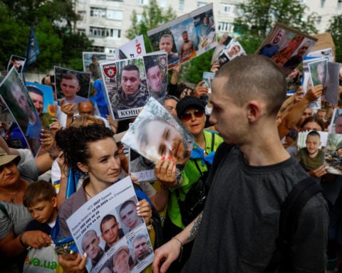 Ukrainian woman searches for husband lost in action two years ago