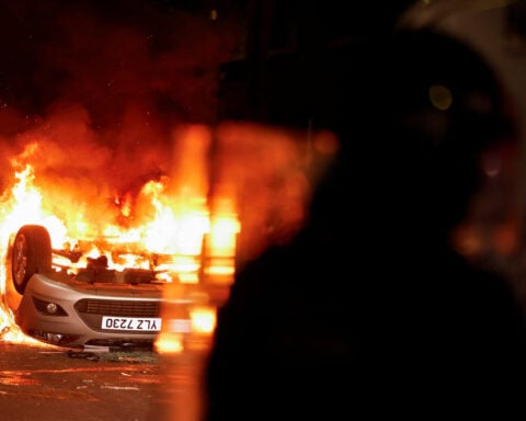 Northern Irish rioters attack police, torch houses for second night