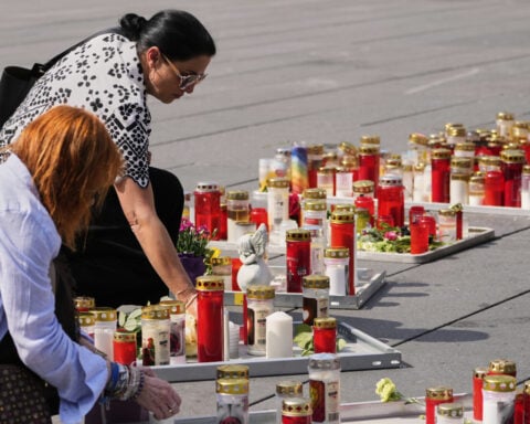 Austria falls silent for a minute as questions remain about the motive for a deadly school shooting