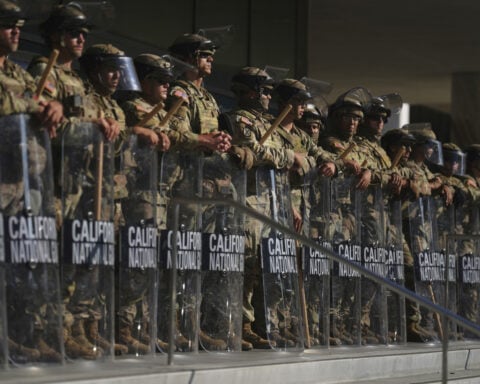 The Latest: Los Angeles police have made nearly 400 arrests and detentions since Saturday