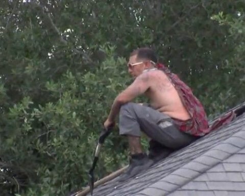 Neighbors express concern after man climbs roof while running from police