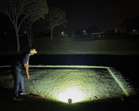 Flashlights and glowing golf balls. How a NY man played for 35 hours in quest for world record