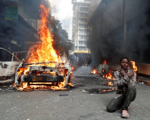 Kenyan policeman arrested in blogger's death as hundreds protest