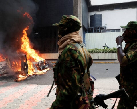 Kenyan policeman arrested in blogger's death as hundreds protest