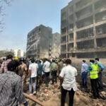 Rescuers search for missing people, aircraft parts after Air India crash kills over 240