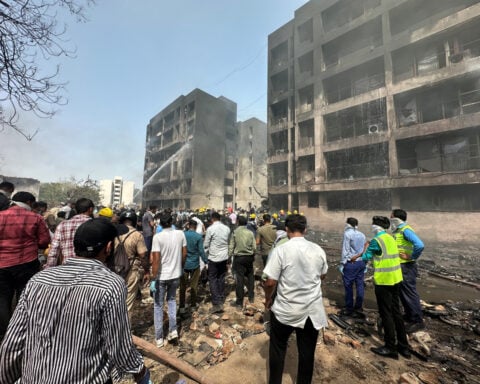 Rescuers search for missing people, aircraft parts after Air India crash kills over 240