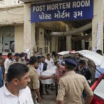Indian authorities begin probe of Air India plane crash as Modi visits the site
