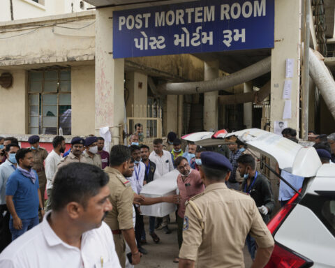 Indian authorities begin probe of Air India plane crash as Modi visits the site