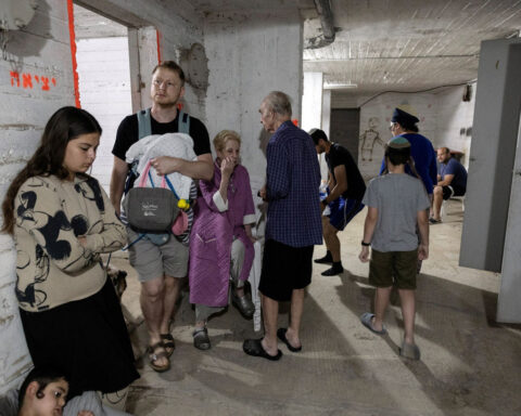 ‘The situation is far from funny, but you have to keep your sanity’: Israeli families face uncertain nights in bomb shelters