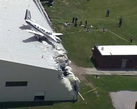 Plane crashes into roof of hangar at New Century Airport