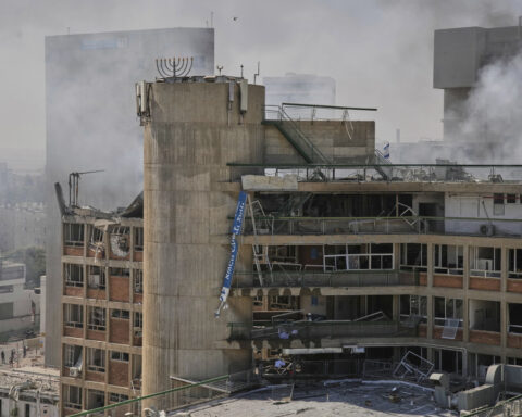 The Latest: Israel threatens Iran's supreme leader as Iranian strikes wound over 200
