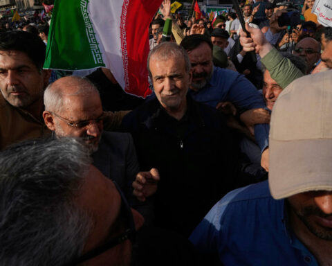 The Latest: Israel strikes Iranian government targets as Trump muses about 'regime change'