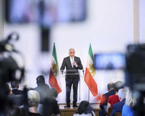 The Latest: Israel strikes Iranian government targets and warns of more in days ahead