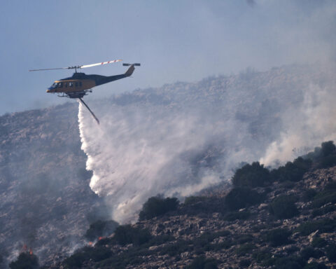 Wildfire prompts evacuations near Athens as summer's first heat wave hits Greece