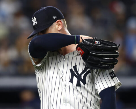 Yanks' Ian Hamilton, frustrated with himself, stares down A's rookie Jacob Wilson