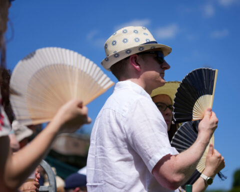 Record heat at Wimbledon has players and fans trying to keep their cool amid scorching conditions