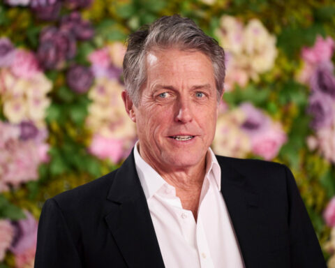Hugh Grant looks to be one tired tennis fan at Wimbledon