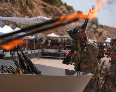 Kurdish PKK militants burn weapons in landmark step to end decades-long Turkey conflict