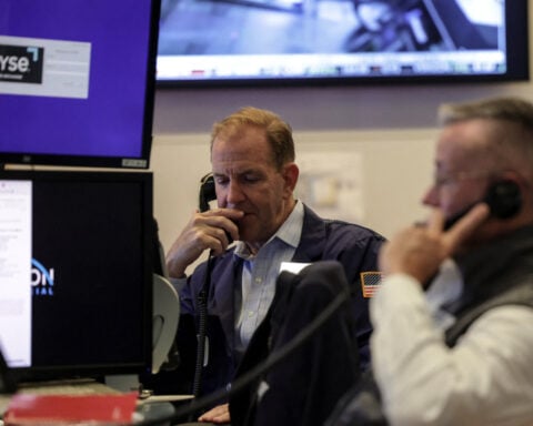 Wall Street ends with modest gains as investors await earnings, economic data