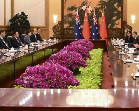 Australian and Chinese leaders seek to boost trade despite differences on other issues