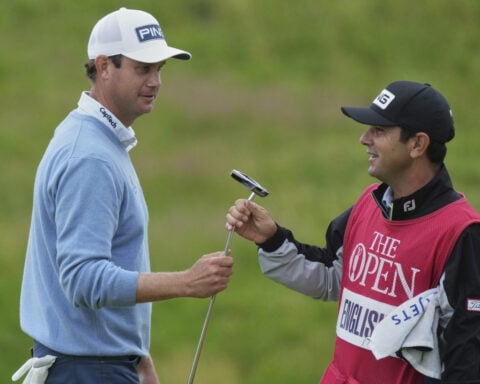 British Open has 5-way tie for the lead in fickle weather with Scottie Scheffler in the mix