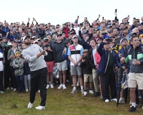 Scottie Scheffler with a 64 sets a daunting target at the British Open