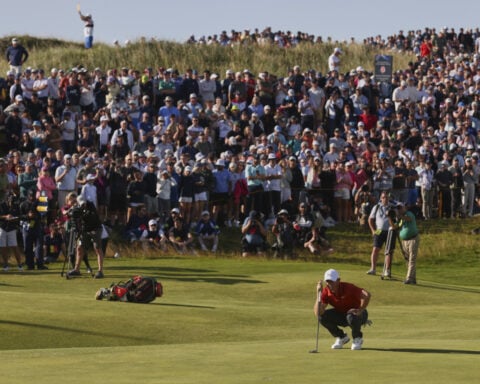 Buried ball baffles McIlroy in wild ride for hometown hero at British Open