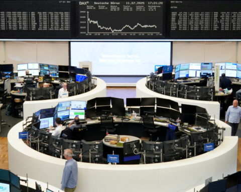 Wall Street indexes end split amid mixed earnings, crude slides as trade deadline looms