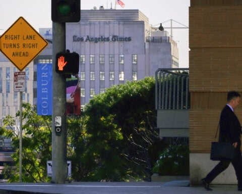 Billionaire owner of the Los Angeles Times says he will take the newspaper public in the coming year