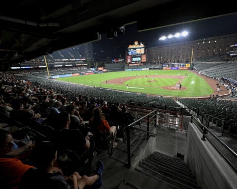 Why did the Orioles and Rockies keep playing after fans evacuated seats?