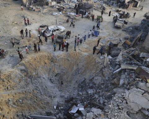 Israeli fire kills dozens in Gaza, officials say, as aid delivery remains chaotic after new measures