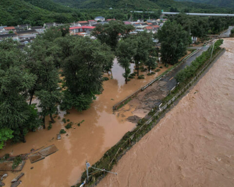 Streets turn to rivers as deadly flooding inundates northern Beijing